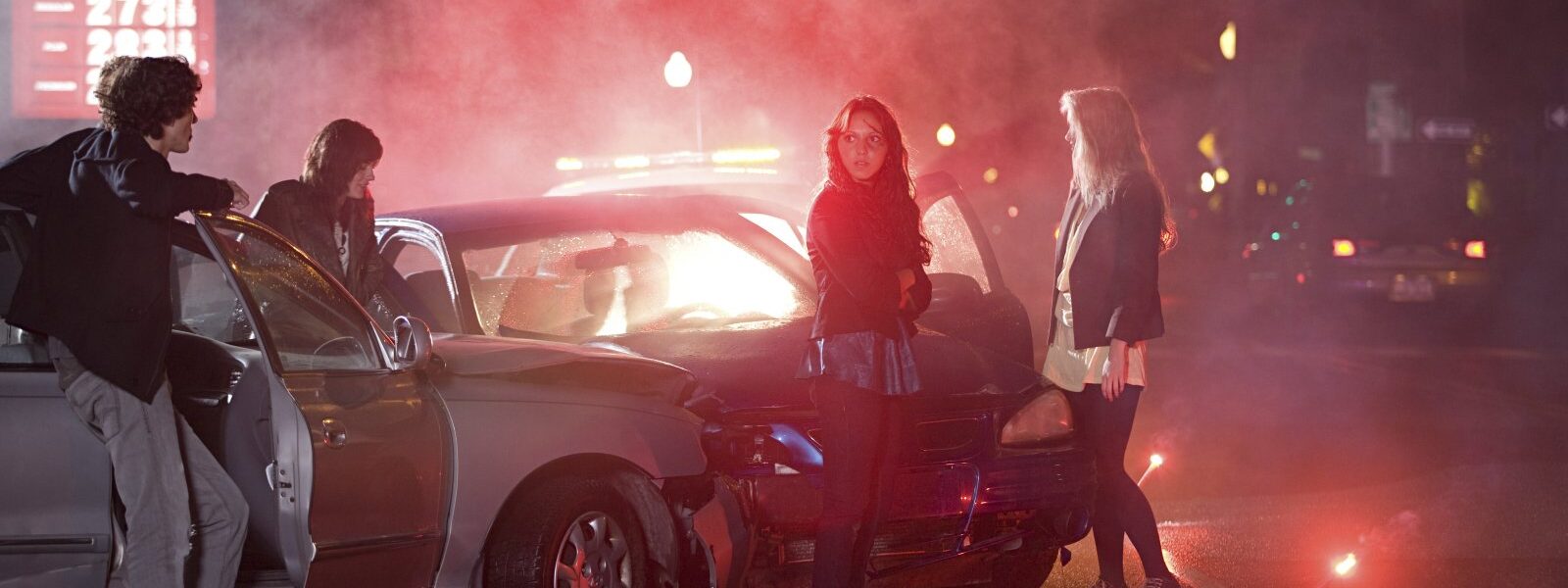 a group of people gathered around a car at a foggy 2024 05 25 00 03 22 utc