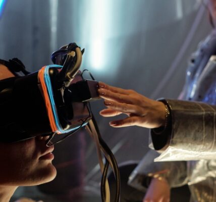 hand of young woman touching virtual reality heads 2023 11 27 05 17 23 utc e1733231809288